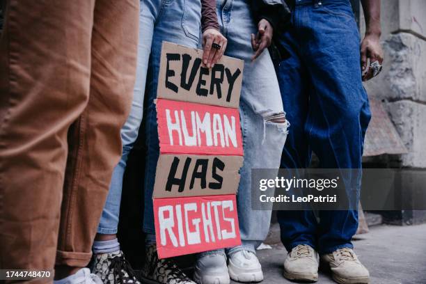 Group of people marching for human rights in New York City.